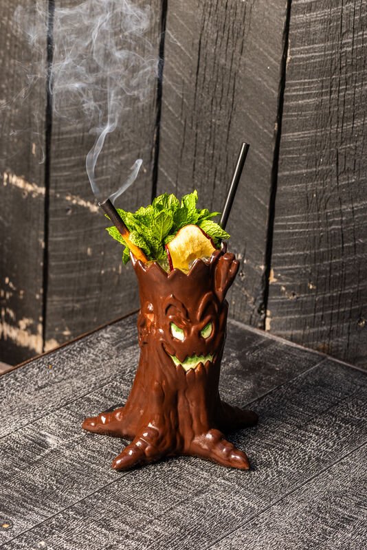 A close up shot of the Poison Apple drink at Adrift Tiki Bar's Halloween popup