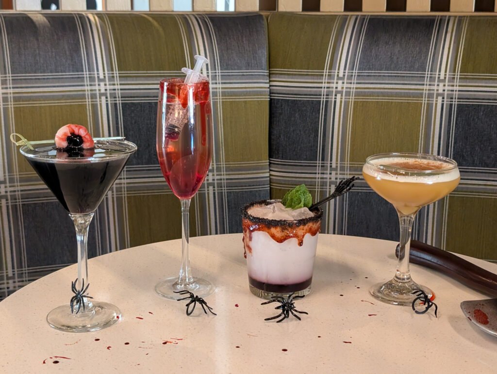 A close up shot of the Halloween special seasonal drinks at The Corner Office Martini Bar at The Curtis Hotel
