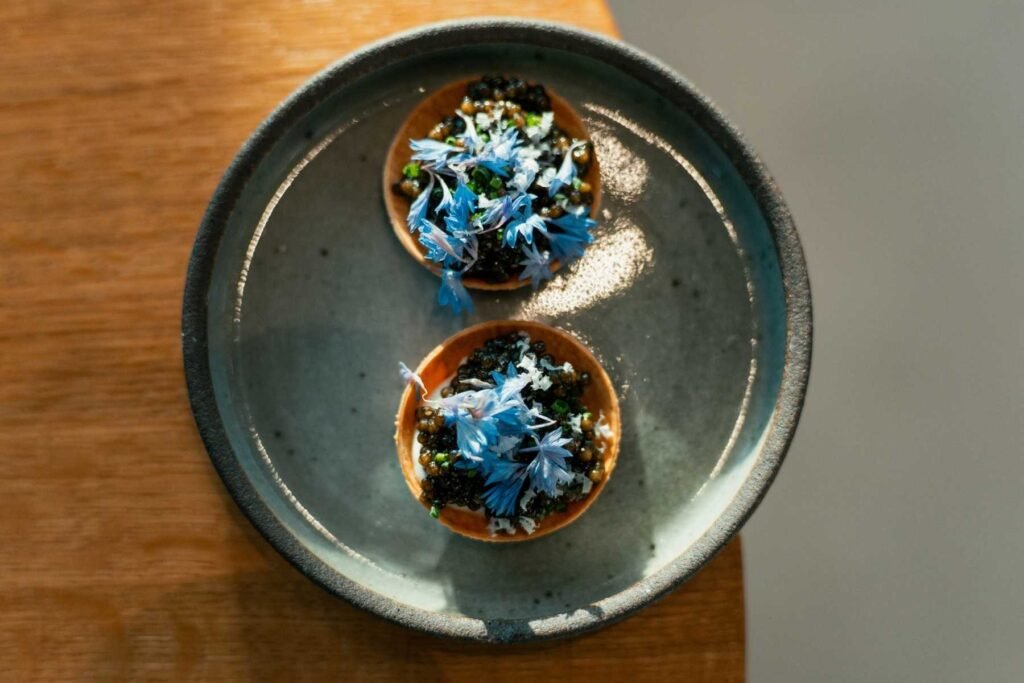 A dish served at
Margot restaurant by Chef Justin Fulton, featuring Esoterra's
edible flowers.