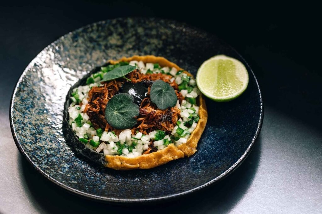 A new sopes dish that will be debuting on
Xiquita's masa menu. Sopes are essentially a thicker tortilla
crimped along the edges, creating a varied texture.